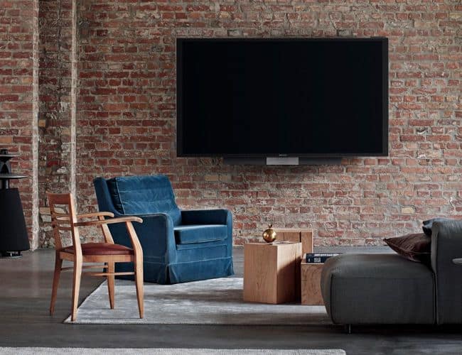 Wall Mounted TV Screen On A Brick Wall